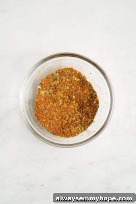 A closer view of the perfectly mixed dry spices in a bowl, ready to flavor the vegan tofu scramble.