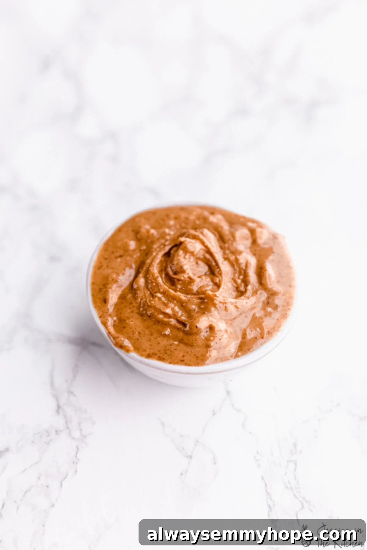 Creamy Thai Peanut Sauce 4 Peanut butter in a small container.