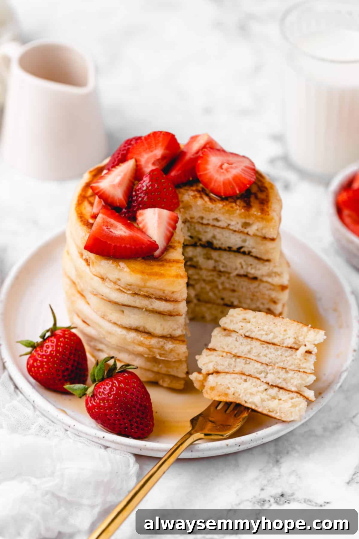 Sliced pancake stack with strawberries.