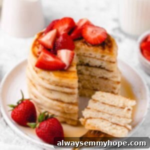 Sliced pancake stack with strawberries.