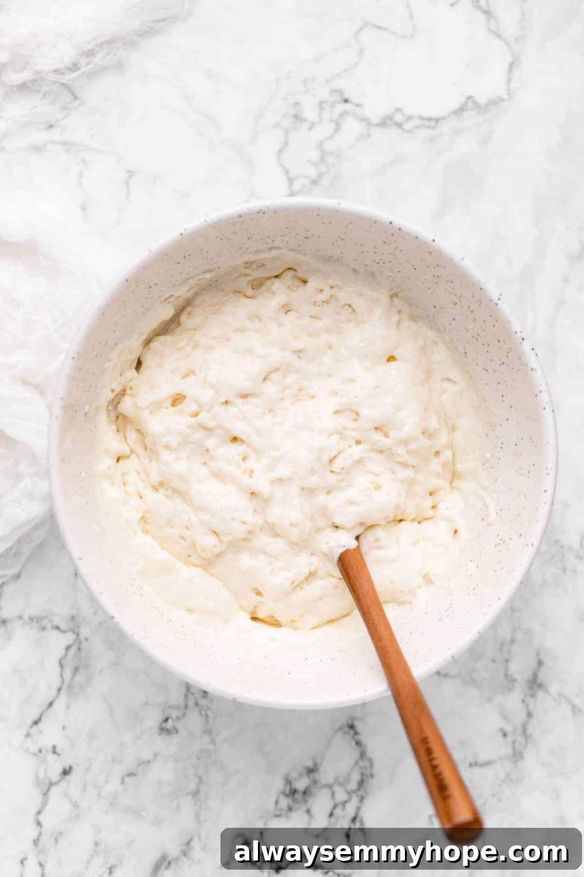 A bowl of pancake batter being mixed.