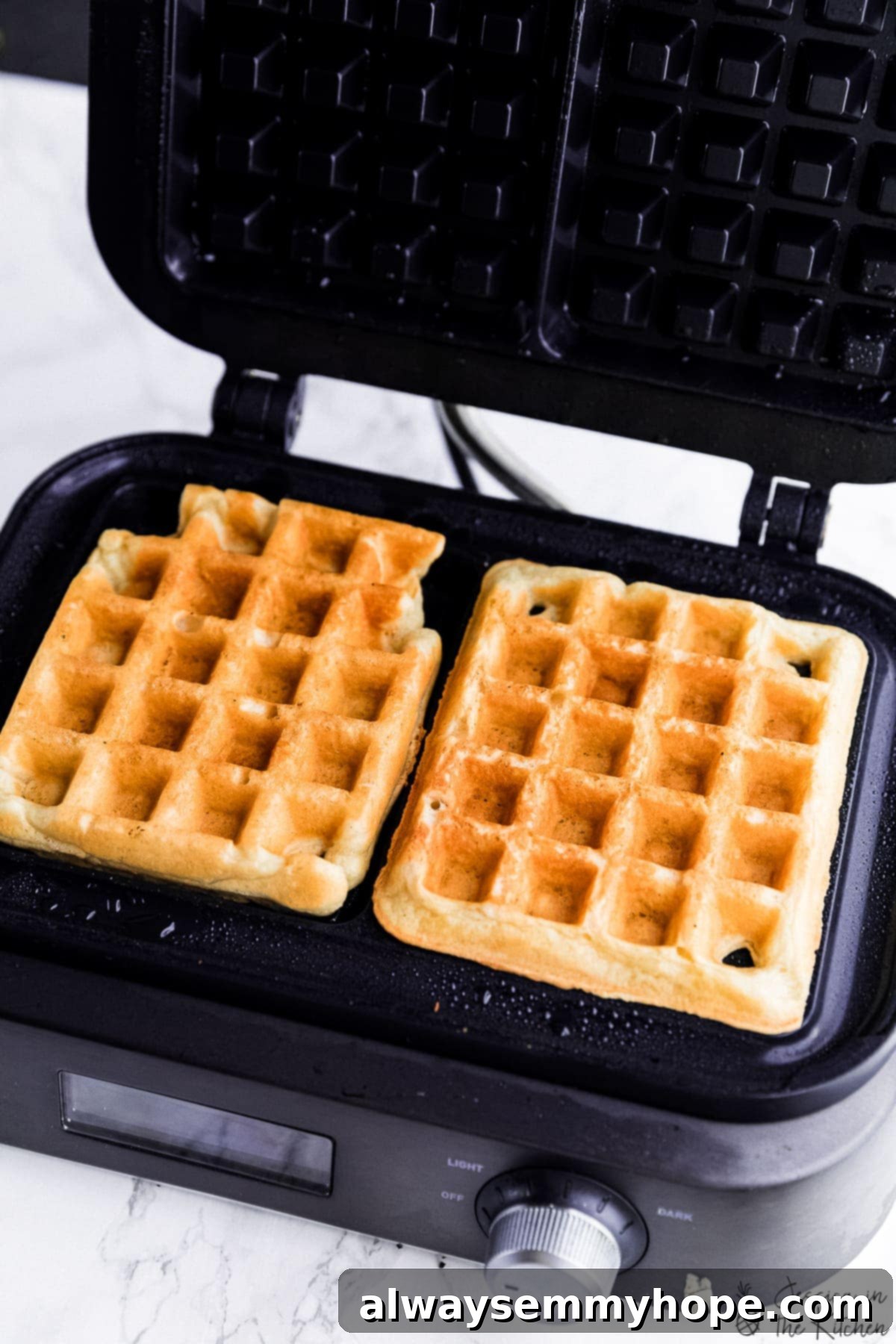 Irresistibly Fluffy Crispy Vegan Waffles 5 Freshly made vegan waffle in a waffle maker, showing golden crisp edges