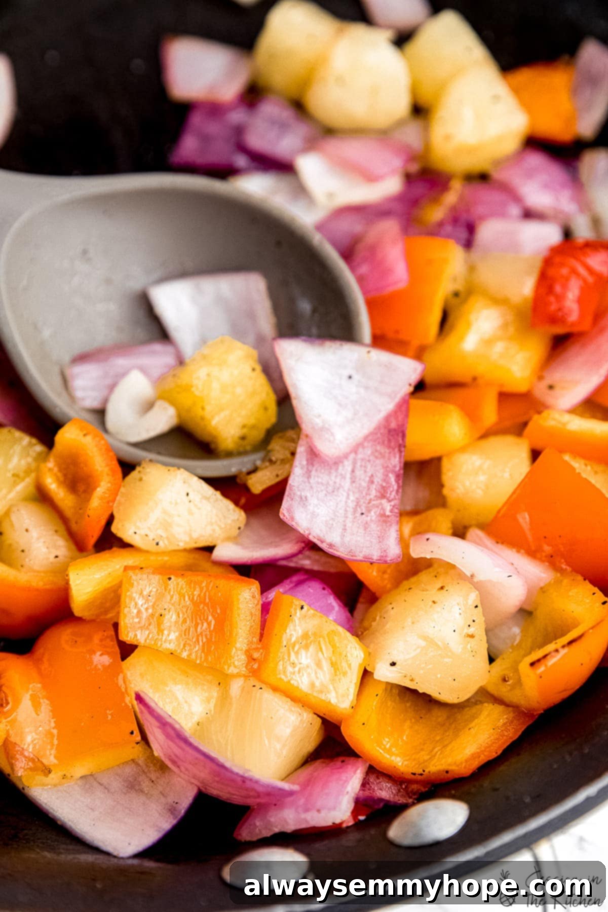 Crispy Vegan Sweet and Sour Tofu 5 Fresh ingredients for sweet and sour tofu: vibrant red onions, colorful bell peppers, and juicy pineapple chunks.