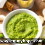 A vibrant green pea pesto, made creamy with cashews, showcased in a bowl, ready to be enjoyed.