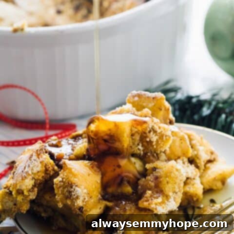 An Overnight Baked French Toast Casserole garnished with berries and powdered sugar.