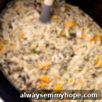 Creamy Mushroom Wild Rice Soup in a slow cooker, ready to be served.