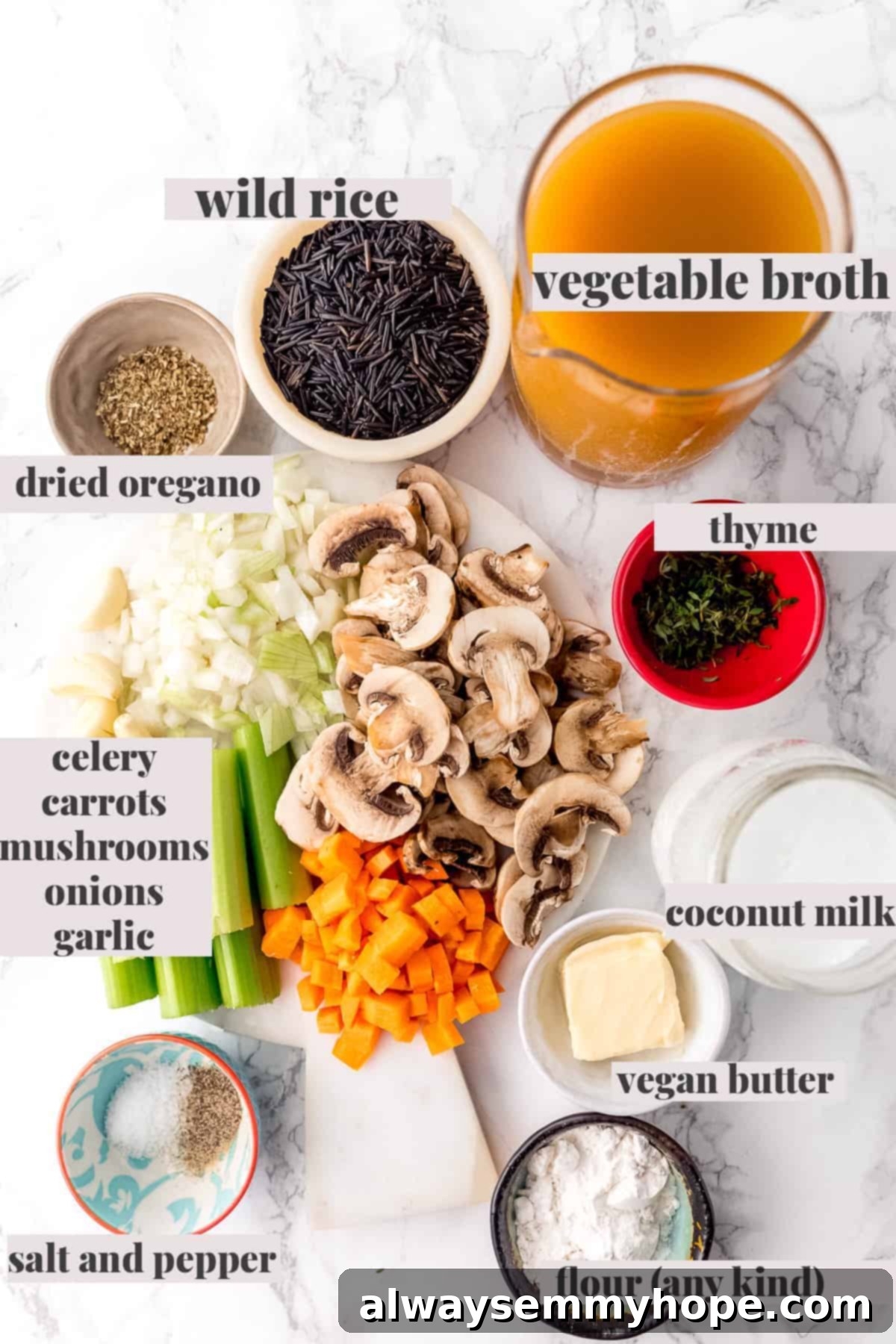 Arrangement of fresh ingredients for the soup including mushrooms, carrots, celery, onion, and wild rice.