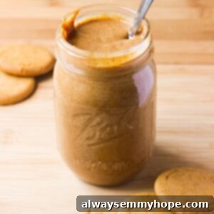 Side on shot of cookie butter in a glass jar.