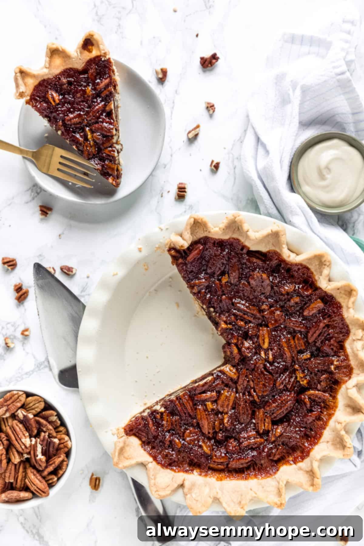 Overhead view of a slice of vegan pecan pie on a plate next to the rest of the pie in pie dish.