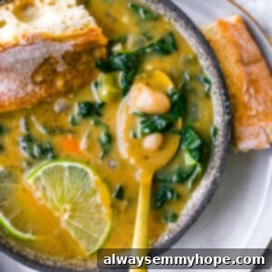 A top-down view of a comforting bowl of White Bean Soup, ready to be served.