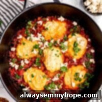 Wholesome Vegan Shakshuka 13 shakshuka in a cast iron skillet with parsley sprinkled over