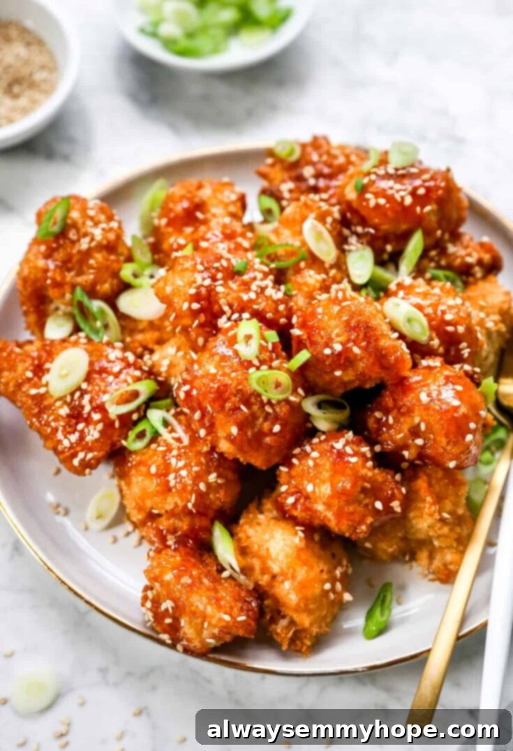 Sweet and Sour cauliflower wings, a tangy and crispy vegan treat with homemade sauce.