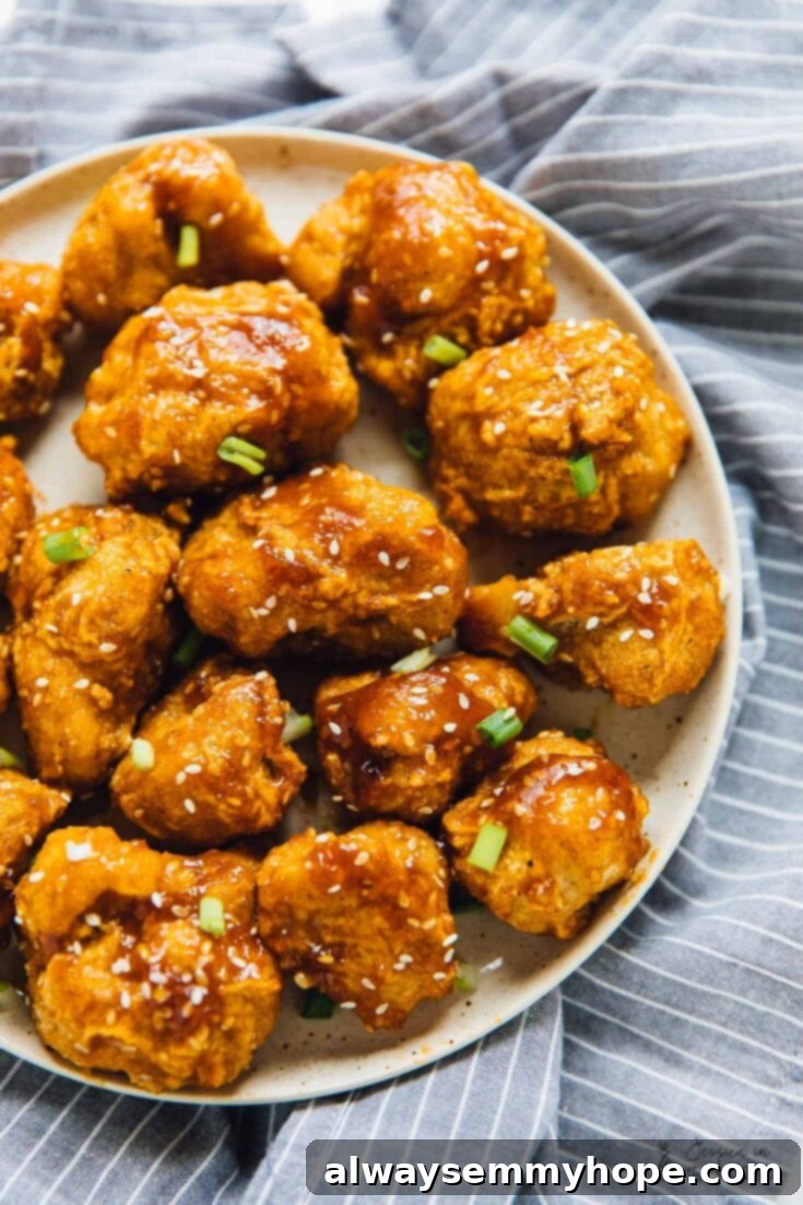 Sweet and Sticky Orange cauliflower bites, an Asian-inspired vegan dish for quick meals.