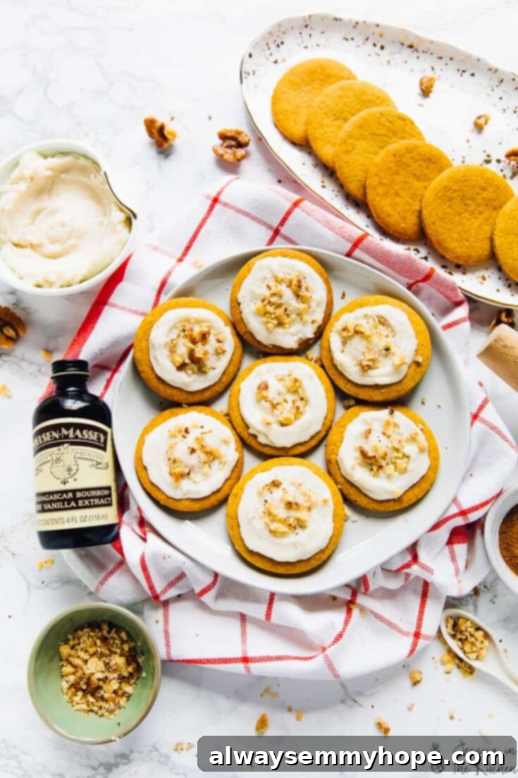 13 Irresistible Vegan Cookie Recipes 12 Beautifully decorated rolled pumpkin spice cookies with creamy vegan frosting, capturing the essence of fall.