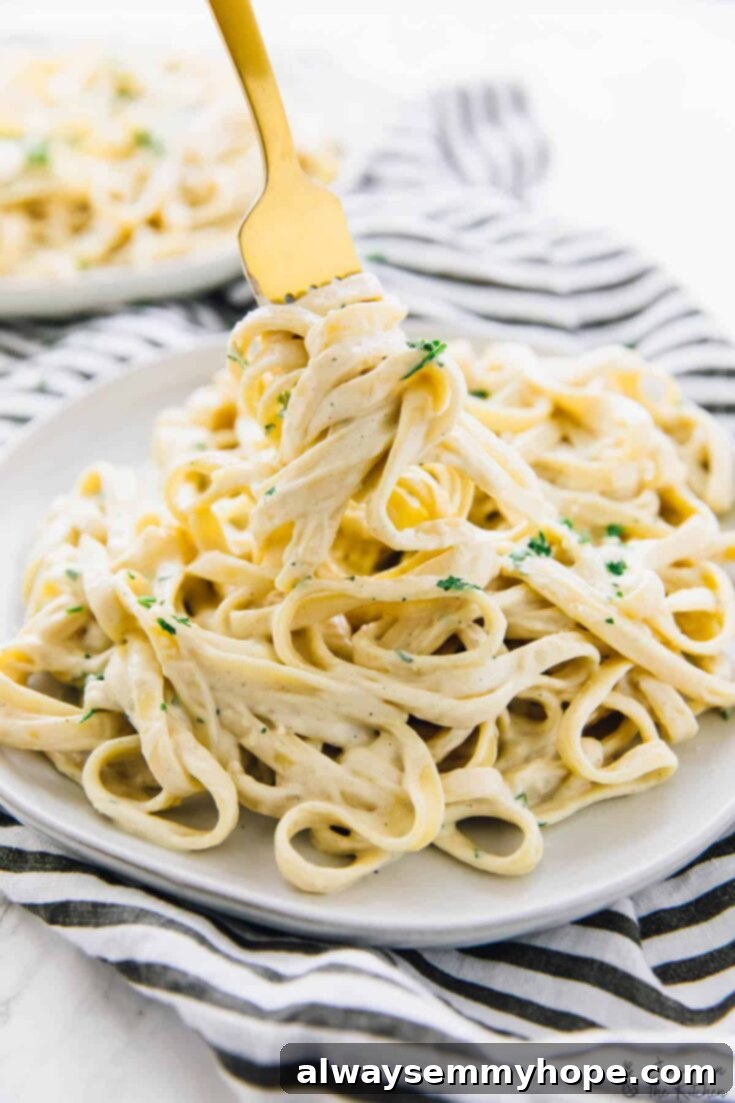 Vegan Garlic Alfredo Pasta, featuring a creamy cashew sauce.