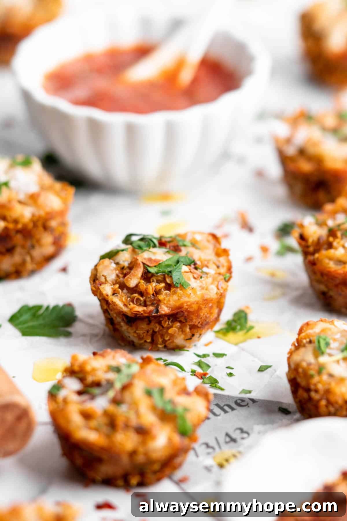 Cooling Quinoa Pizza Bites, ready to be enjoyed as a healthy and delicious snack. A tray of freshly baked quinoa pizza bites cooling on parchment paper