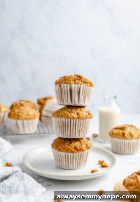 Garden-Fresh Vegan Zucchini Muffins 17 Three stacked vegan zucchini muffins on a plate, ready to be eaten.
