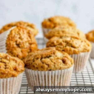 Garden-Fresh Vegan Zucchini Muffins 18 Zucchini muffins on a cooling rack.