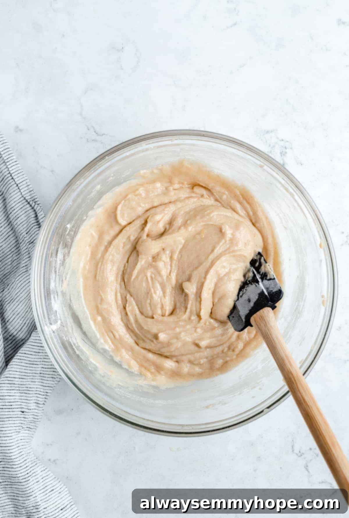 Ultimate Vegan Blueberry Muffins 11 A mixing bowl filled with creamy muffin batter, before the addition of blueberries.
