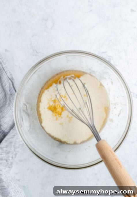 Ultimate Vegan Blueberry Muffins 8 Vegan buttermilk being added to the bowl with oil, sugar, and vanilla for the muffin batter.