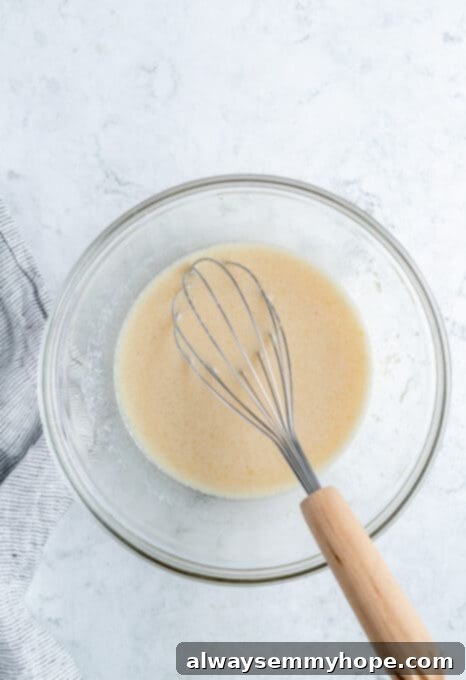 Ultimate Vegan Blueberry Muffins 9 The thoroughly whisked wet ingredients for blueberry muffins, looking smooth and well combined.