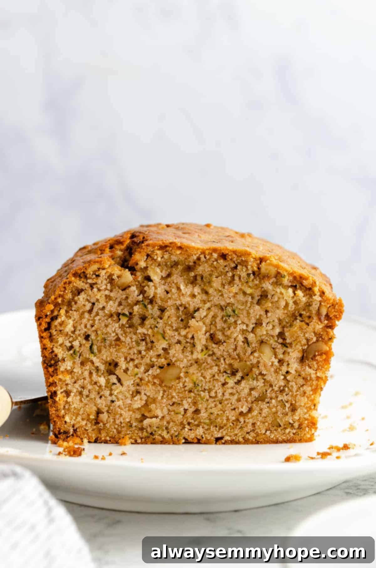 Loaf of bread with grated zucchini and walnuts.