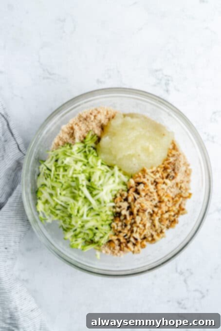 Grated zucchini, applesauce, and walnuts added to batter.