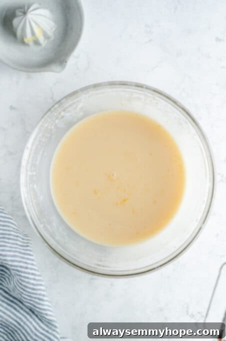 The fully combined wet ingredients for the lemon loaf cake, smooth and uniform.
