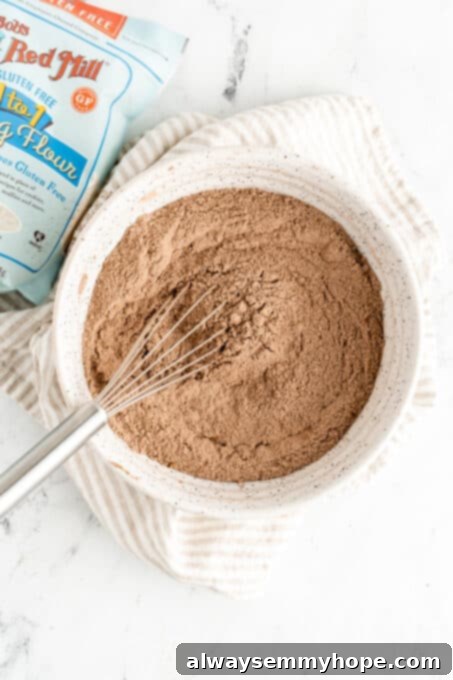 whisk mixing dry ingredients for the cake