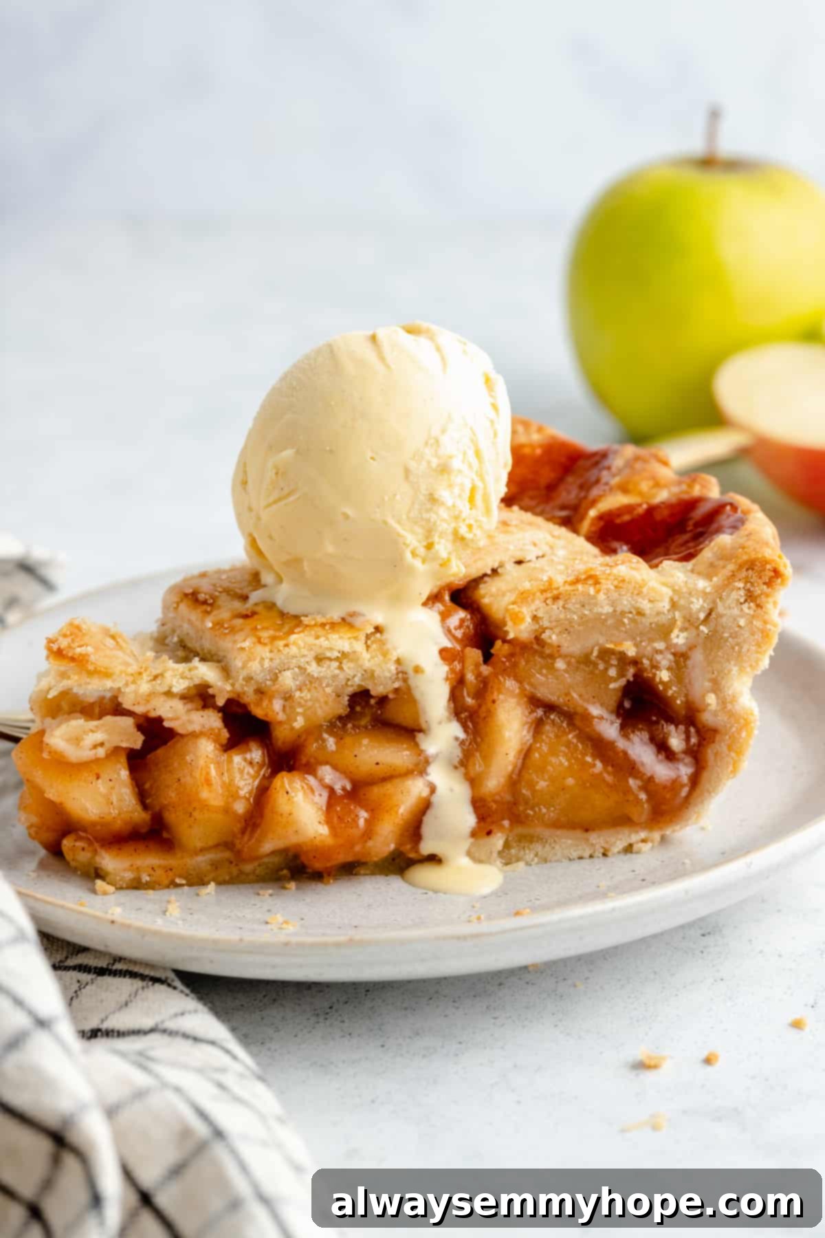Perfect Vegan Apple Pie 2 Vegan apple pie with a scoop of vanilla vegan ice cream on top.