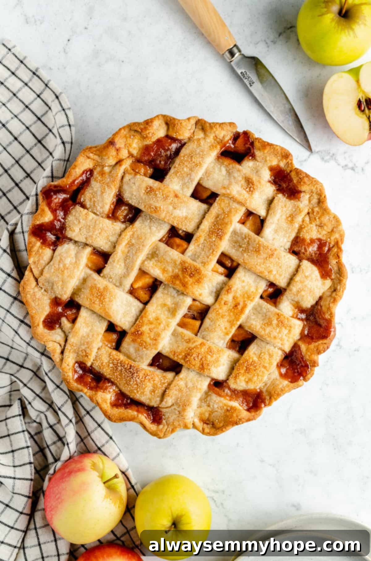 Perfect Vegan Apple Pie 14 A perfectly baked vegan apple pie with a golden lattice top, fresh out of the oven.
