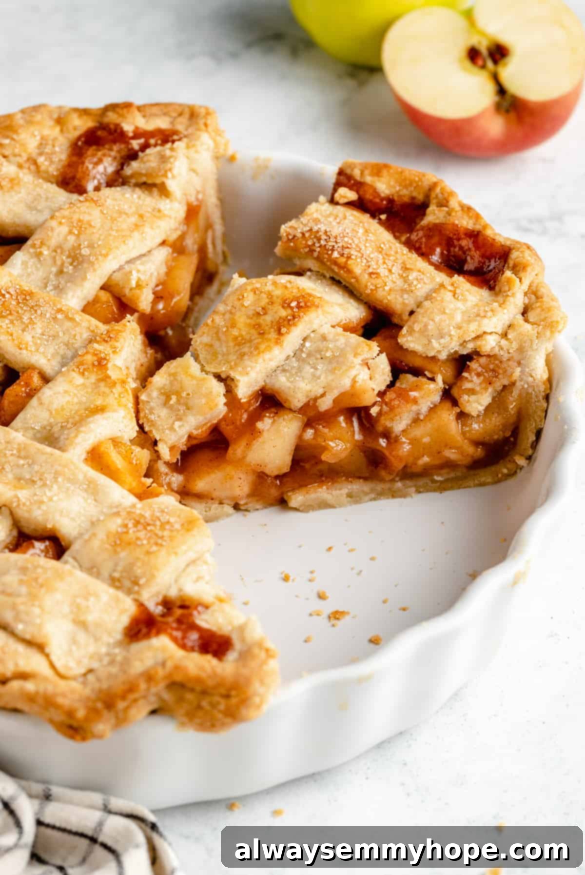 Perfect Vegan Apple Pie 15 A whole vegan apple pie in a baking dish, showcasing its golden-brown, flaky crust.