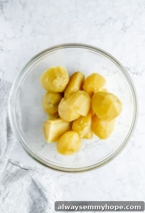 Overhead shot of cooked potatoes in glass bowl