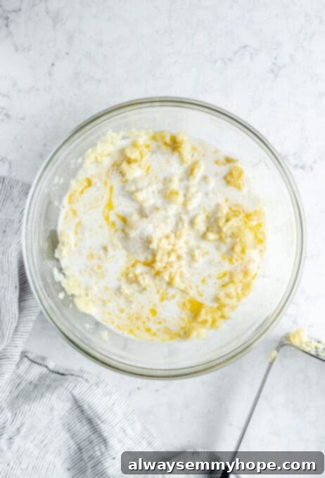 Coconut milk and butter being added to potatoes