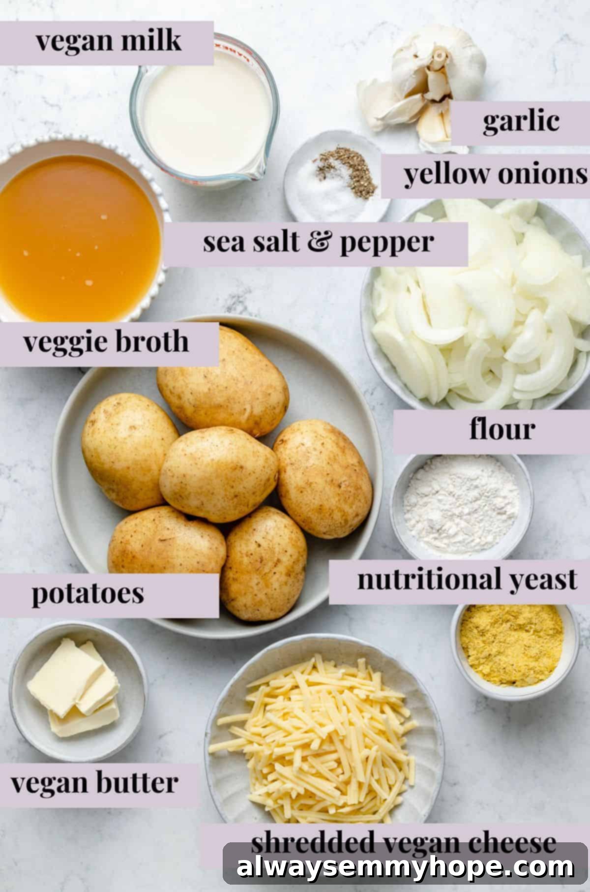 My creamy vegan scalloped potatoes are dairy-free, cheesy, and easy to make! The perfect side dish for Thanksgiving, holidays, and weeknights. Overhead view of vegan scalloped potato ingredients with labels