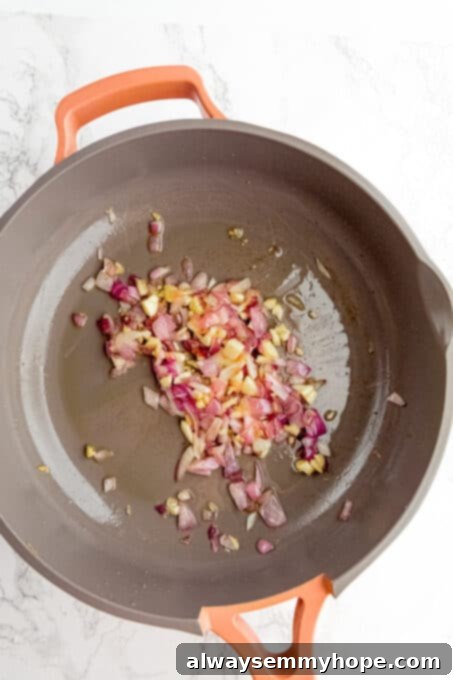 Sautéed onions and garlic in a skillet.