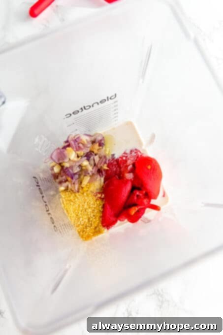 Red pepper pasta sauce ingredients added to the blender.