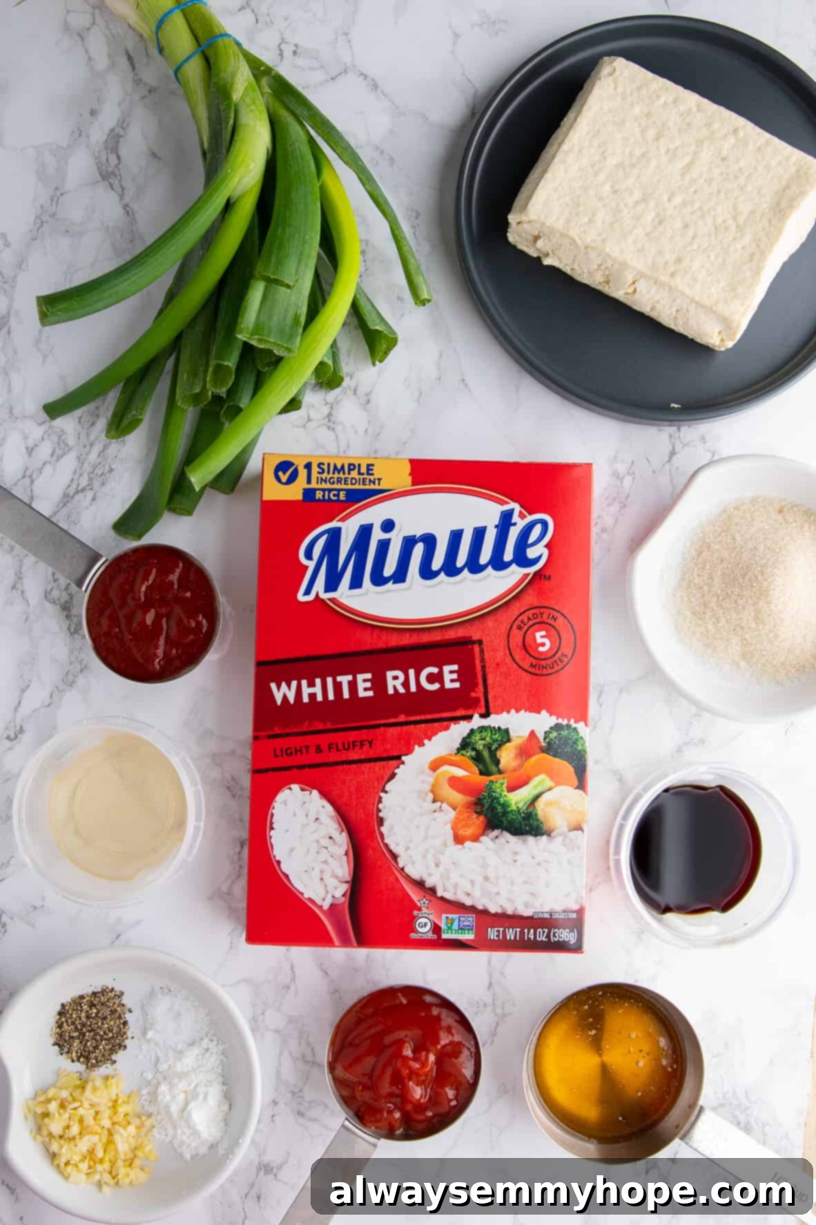 Korean Gochujang Tofu Rice Bowls 3 A selection of fresh ingredients laid out, including a box of Minute Instant White Rice, a block of tofu, a jar of gochujang, and various seasonings.