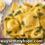 Overhead view of beautifully arranged butternut squash ravioli on a plate, ready to be enjoyed.