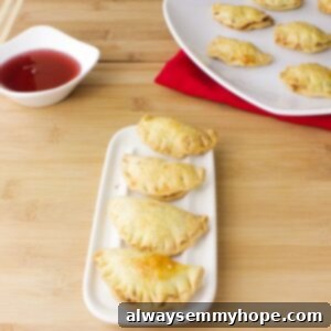 A lovely row of freshly baked Gok Jai peanut puff cookies, golden brown and inviting, arranged on a rustic wooden table.