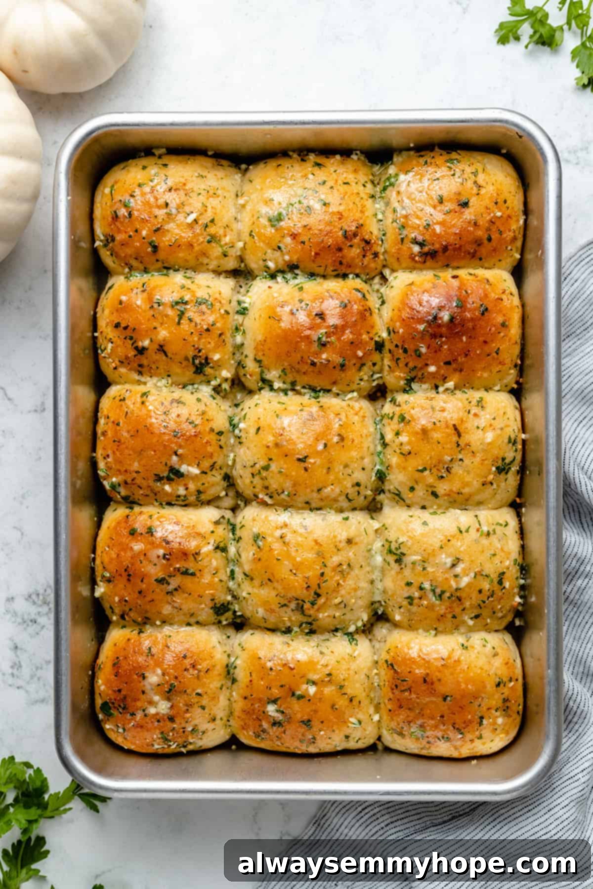 Fluffy Vegan Garlic Parmesan Dinner Rolls 14 Overhead view of vegan garlic parmesan dinner rolls in metal baking pan