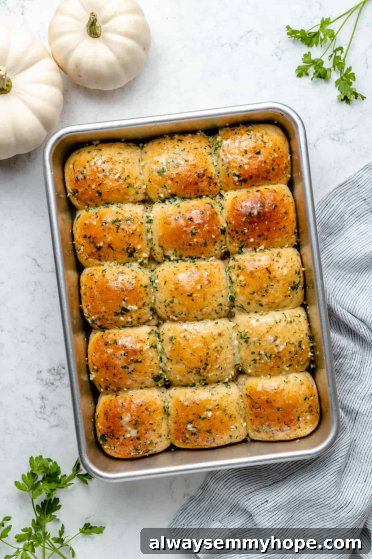 Fluffy Vegan Garlic Parmesan Dinner Rolls 3 Overhead view of garlic dinner rolls in metal baking pan