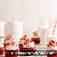 Vegan red velvet cupcakes with cream cheese frosting and cake crumbs on plate