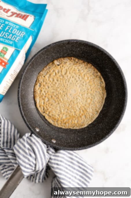 Vegan crepe cooking in pan