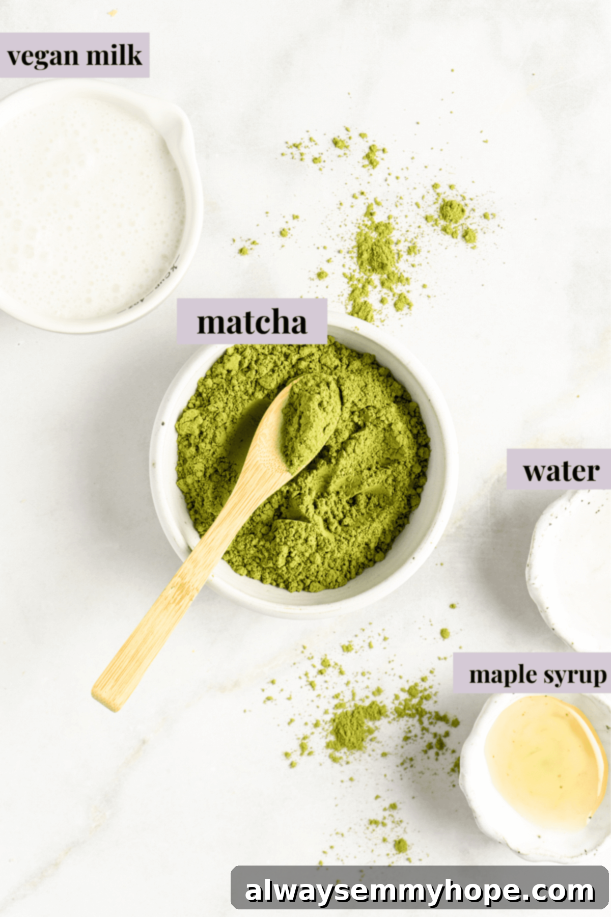 Smooth Iced Matcha Latte 3 Close-up of vibrant green ceremonial grade matcha powder in a small white bowl with a wooden scoop, ready for brewing.