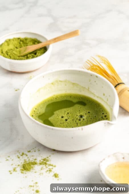 Smooth Iced Matcha Latte 9 Closeup of perfectly brewed and frothed matcha tea in a small, elegant matcha bowl, ready for serving.