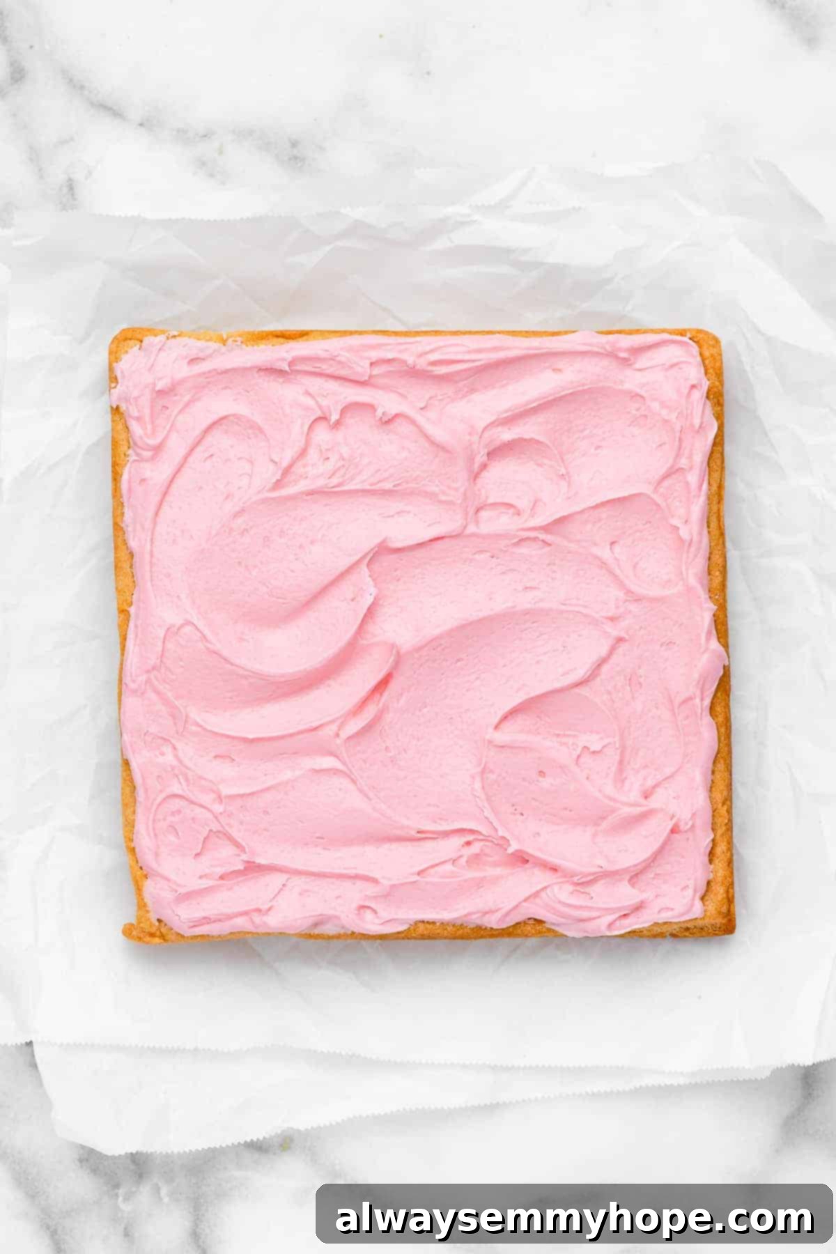 These vegan frosted sugar cookie bars have all the flavor of a classic sugar cookie, without the rolling and cutting, or the dairy and eggs! Overhead view of frosted sugar cookie bars