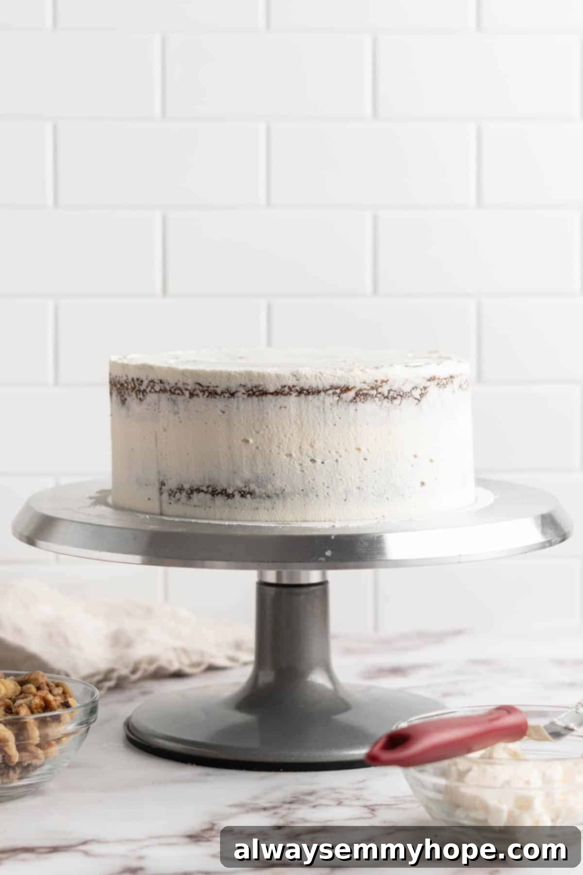 Decadent Plant-Based Carrot Cake 13 Frosting vegan carrot cake on cake stand