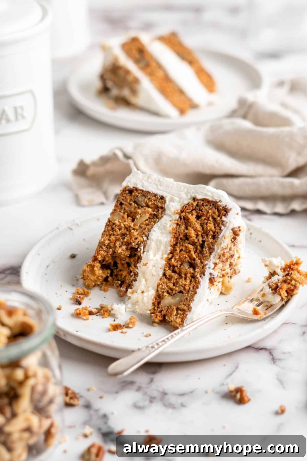 Decadent Plant-Based Carrot Cake 14 Slices of vegan carrot cake on white plates