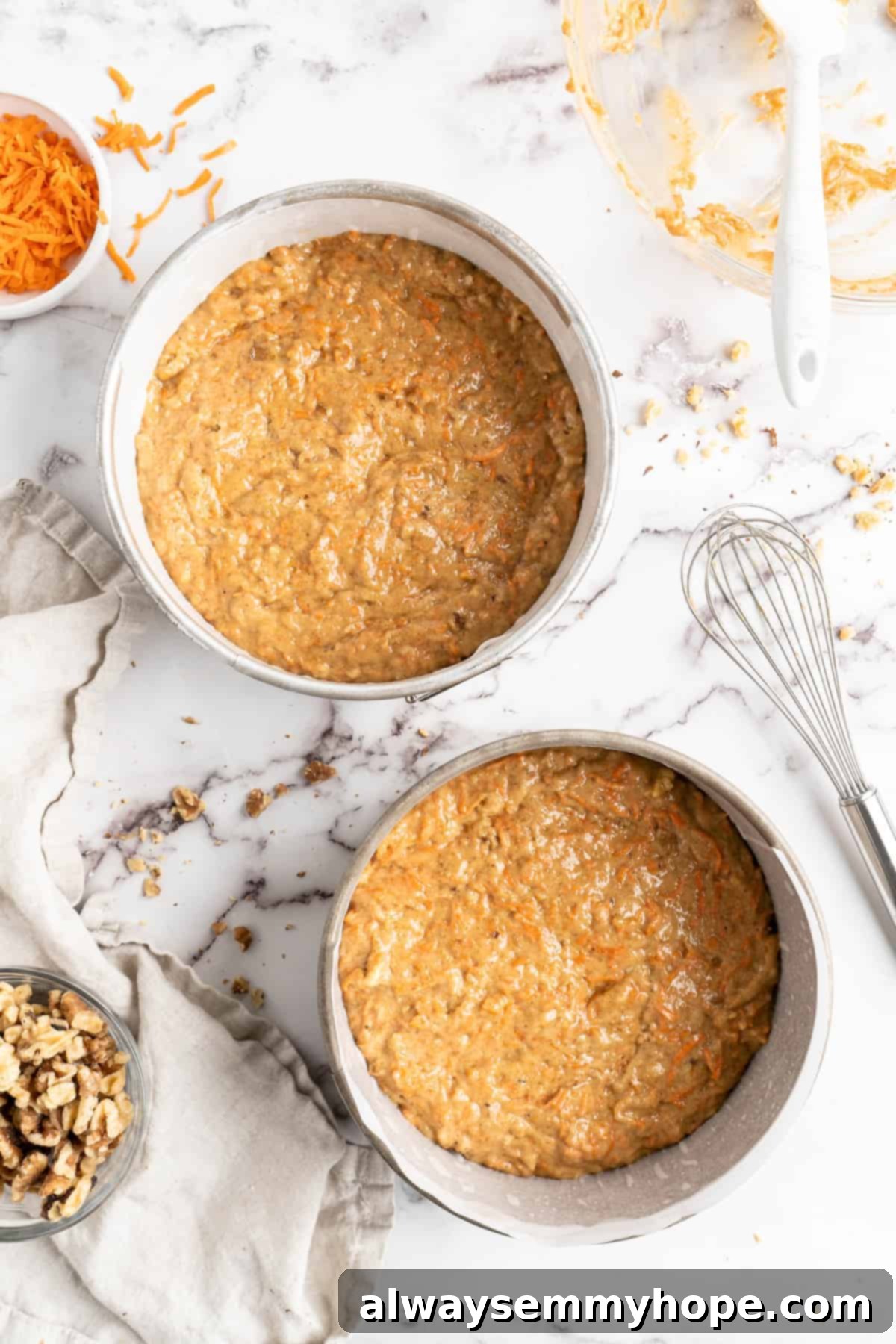 Decadent Plant-Based Carrot Cake 10 Overhead view of vegan carrot cakes in round pans